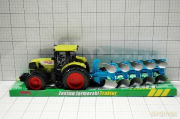 Traktor z maszyną rolniczą pod kloszem
