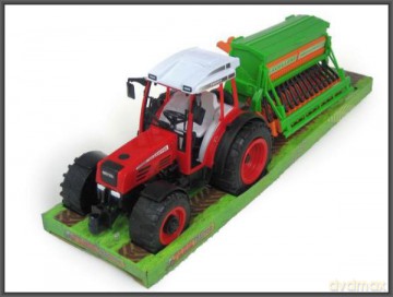 Traktor z siewnikiem pod kloszem