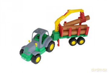 Siłacz traktor z naczepą do przewozu dłużycy w siatce