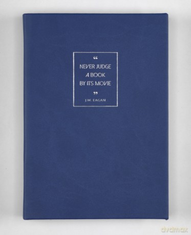 A5 Nb Blue Never Judge a Book By Its Mov (Inspriational Quotes) [KSIĄŻKA]