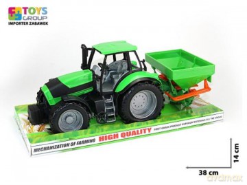 Traktor z maszyną rolniczą pod kloszem