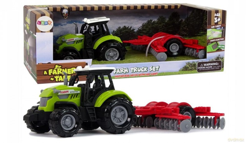 Traktor ze zgrabiarką zielony