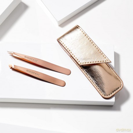 A set of tweezers in a Rose Gold case