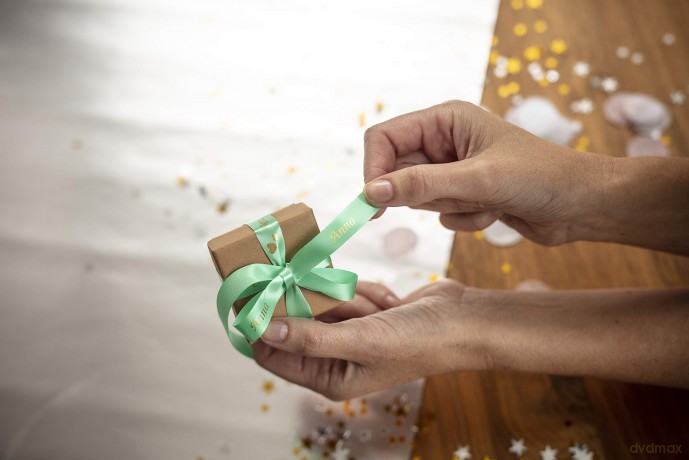 Brother - TZe-RM34 prints gold text on mint green 12mm satin ribbon