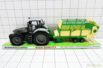 Traktor z przyczepą pod kloszem